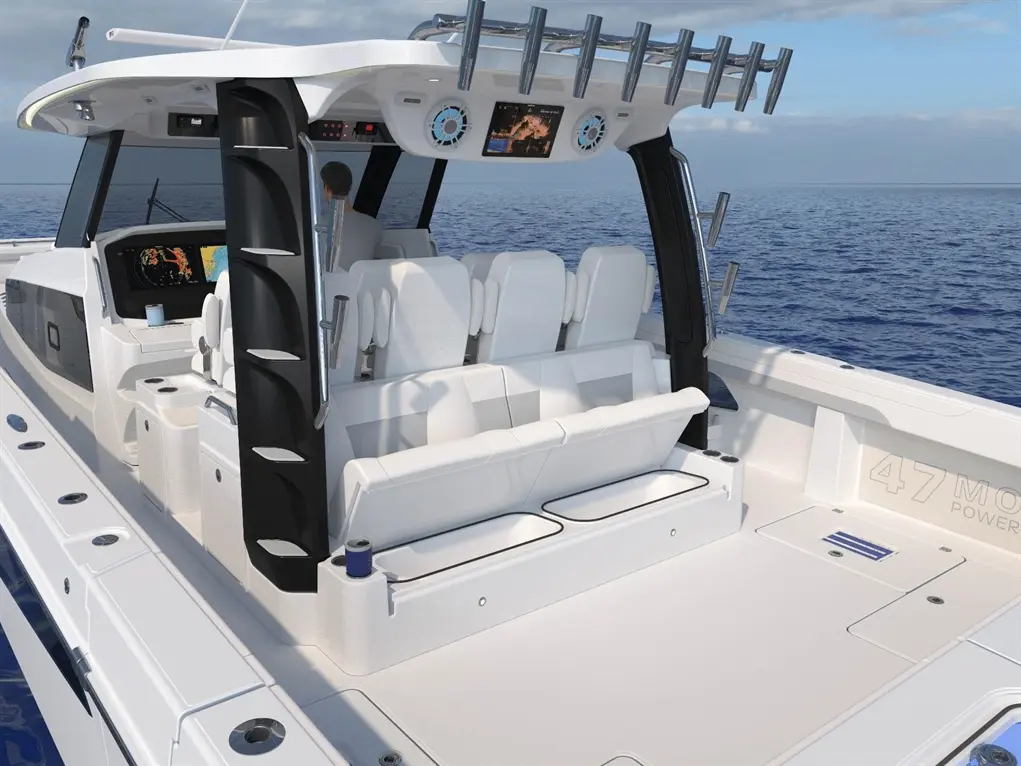 Luxury motorboat interior featuring white seating, control panel, and ocean view. Visible text: "47 MO".